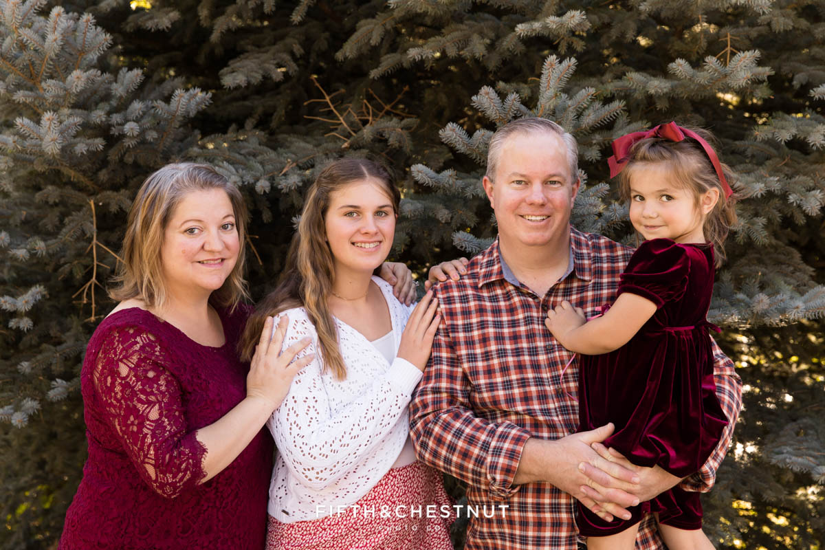 family huddled together for colorful UNR family photos