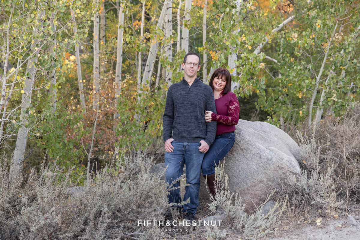 A couple stands together at Thomas Creek for a couple's portrait during their family session.
