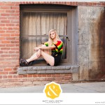 Downtown Reno Teen Portrait - young woman modeling in window on brick building