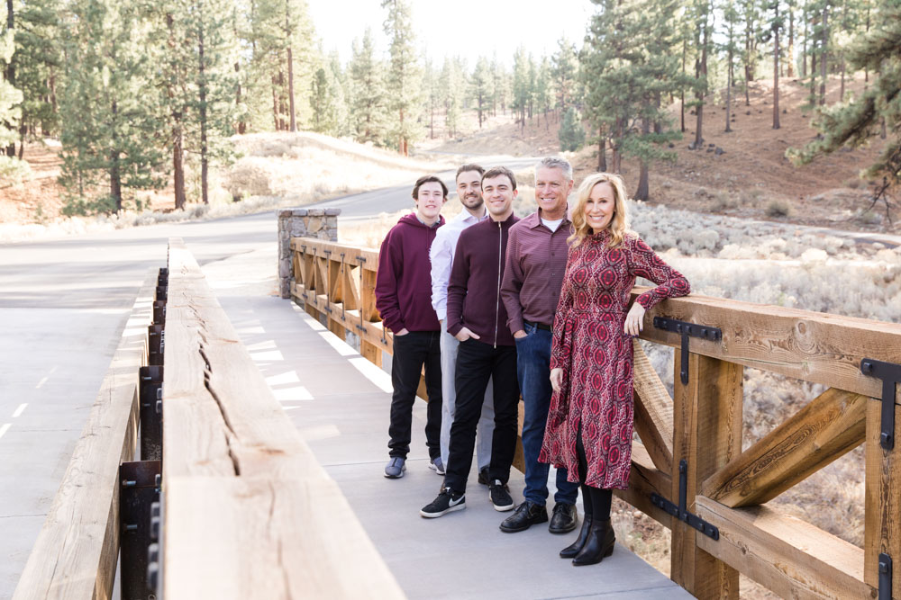 Family wearing burgundy tones on a bridge for Carson City Family Portraits in the Fall