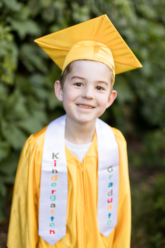 Kindergarten graduate cap and gown portrait by Reno Child Photographer