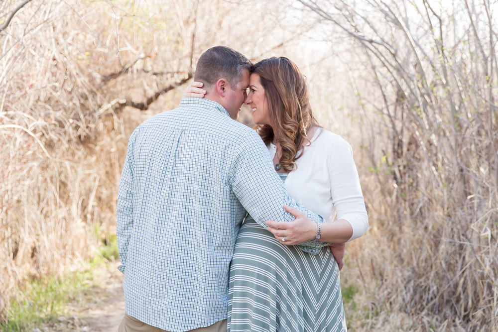 Mom and dad to be embrace for Reno Family and Maternity photo by Reno Maternity Photographer