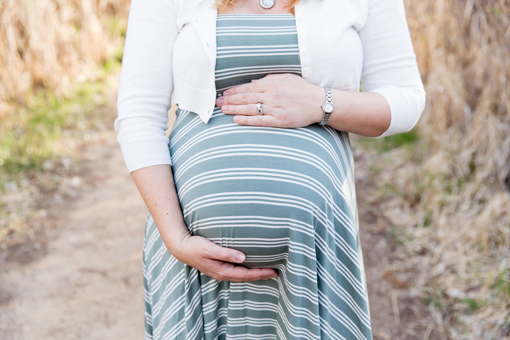 beautiful baby belly on a warm sunny spring day at the Oxbow nature study in Reno for Reno Family and Maternity photo by Reno Maternity Photographer