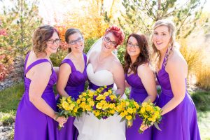 Bride and bridesmaids show off wedding bouquets by Serendipity Floral and Garden for photos by Reno Wedding Photographer