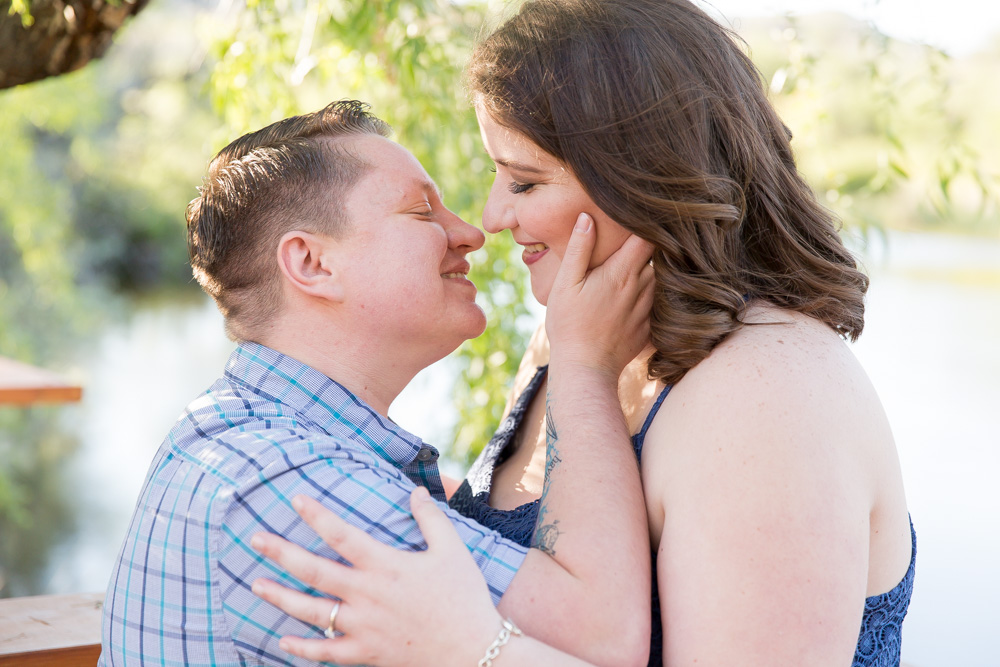 Lesbian couple about to kiss in an engagement photo by Lake Tahoe Wedding Photographer