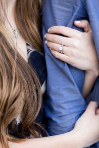 Engagement ring and special necklace details on engaged couple for thier engagement portrait by Lake Tahoe Wedding Photographer
