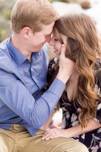 Couple embracing and closing eyes in an engagement portrait by Lake Tahoe Wedding Photographer