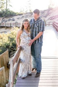 Expecting mother and father stand together at Sand Harbor for Lake Tahoe Maternity Photography by Tahoe Maternity Photographer