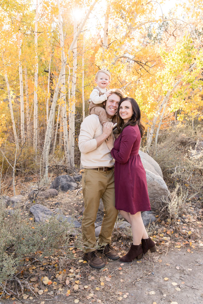 Gorgeous Reno fall family portrait of a family of three with golden aspens in the background