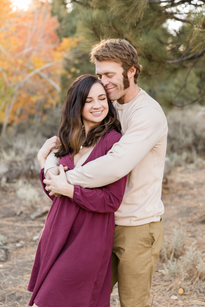 A couple embraces for a Reno fall family portrait