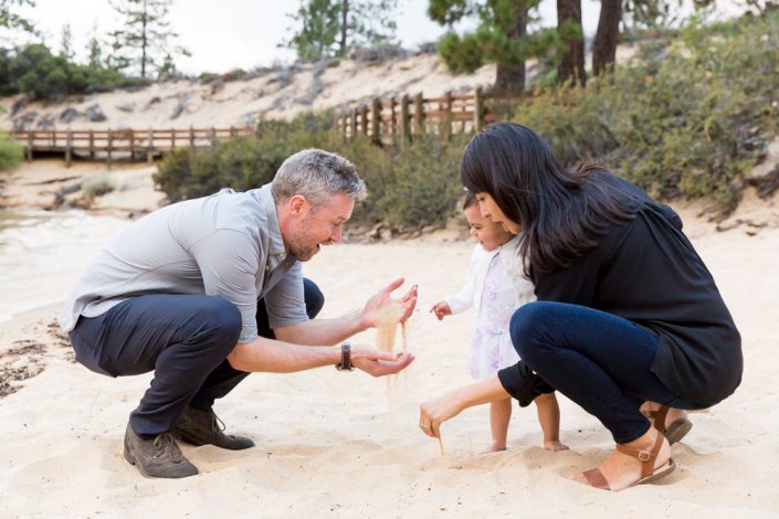 Family plays in the sand at Sand Harbor for family portraits by Lake Tahoe Family Photographer