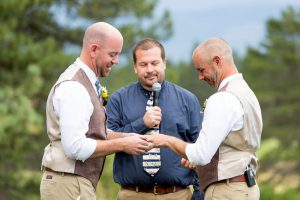 grooms exchange rings at a truckee wedding
