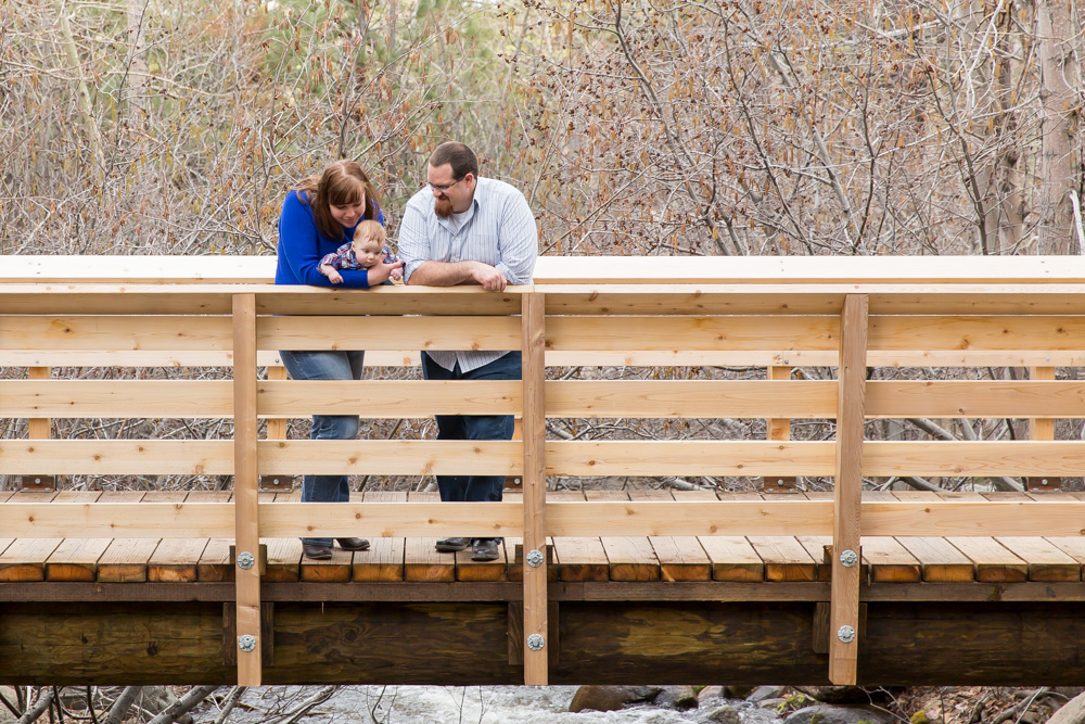 Family stands on Bridge for their family photos at galena creek park by reno family photographer