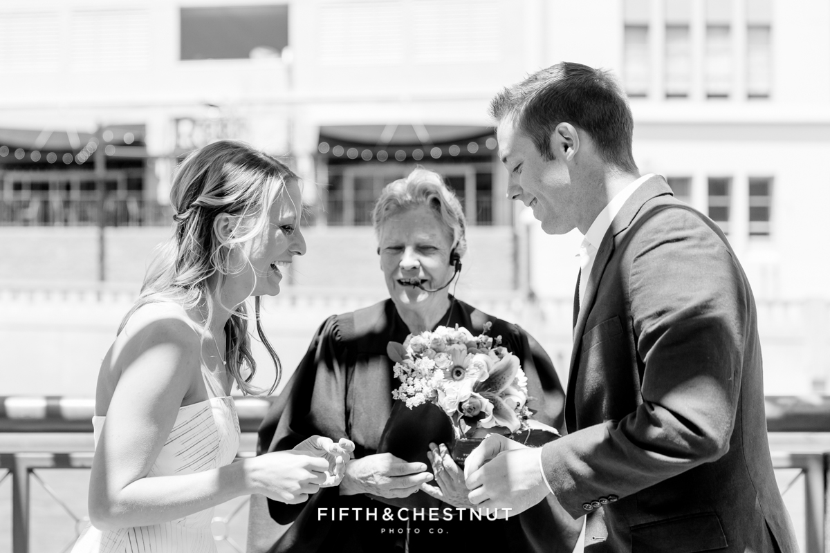 Exchanging of the rings during a Downtown Reno elopement by Reno Wedding Photographer