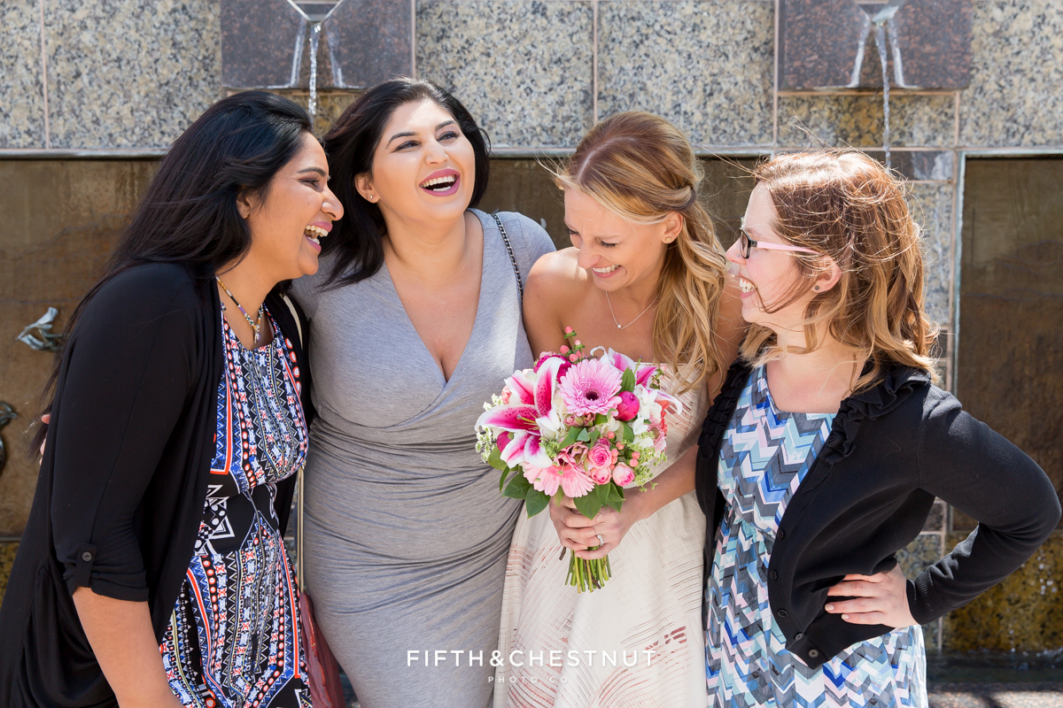 Friends laughing with bride at her Downtown Reno elopement by Reno Wedding Photographer