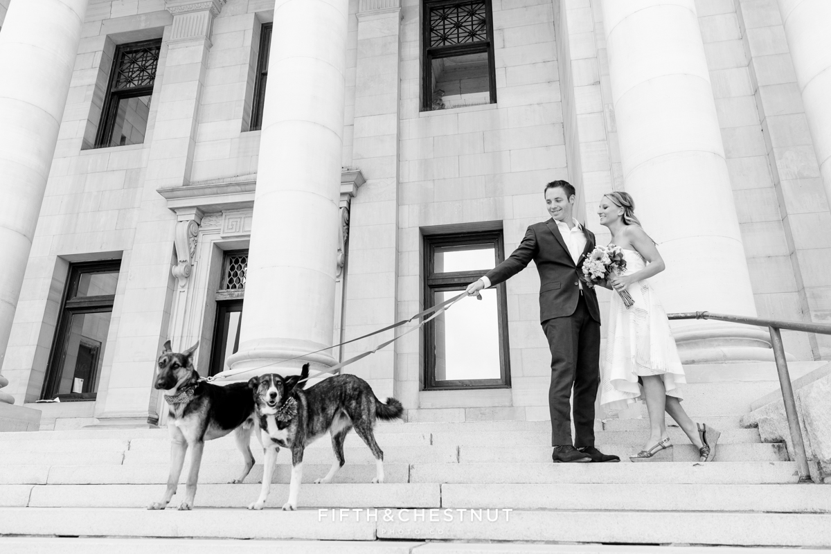 Black and white photo of bride and groom at courthouse for a Downtown Reno elopement by Reno Wedding Photographer