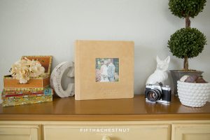 A leather wedding album sitting on a table