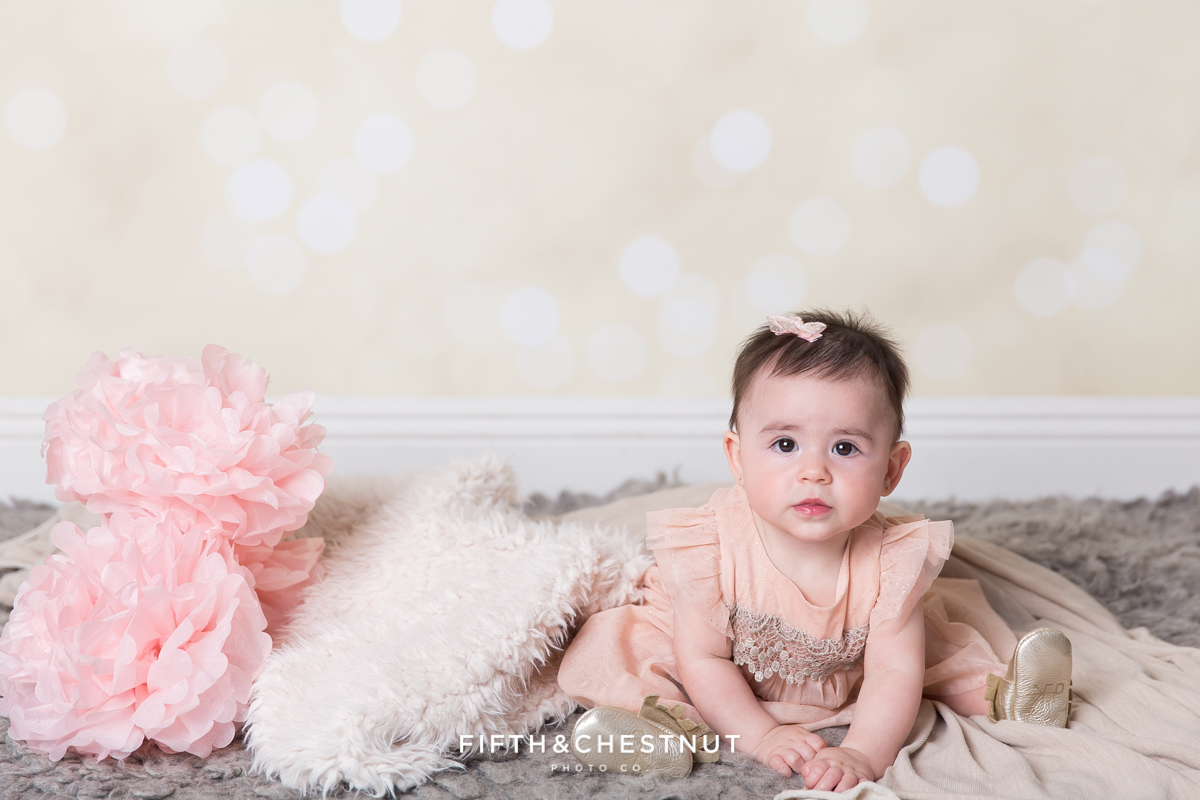 Baby Girl wearing a glittery pink dress for portraits by Reno Baby Photographer Fifth and Chestnut