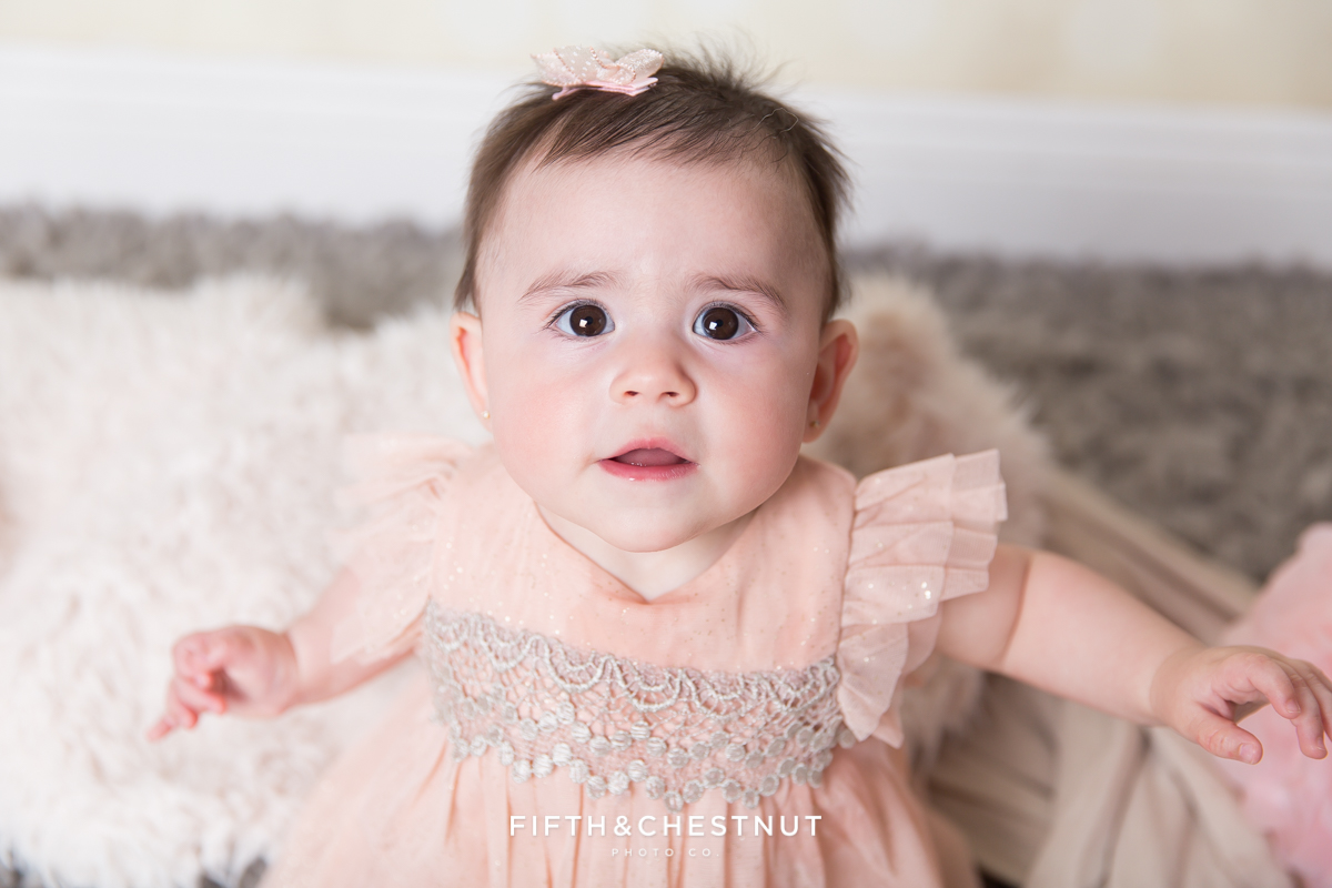 Baby Girl wearing a glittery pink dress for portraits by Reno Baby Photographer Fifth and Chestnut