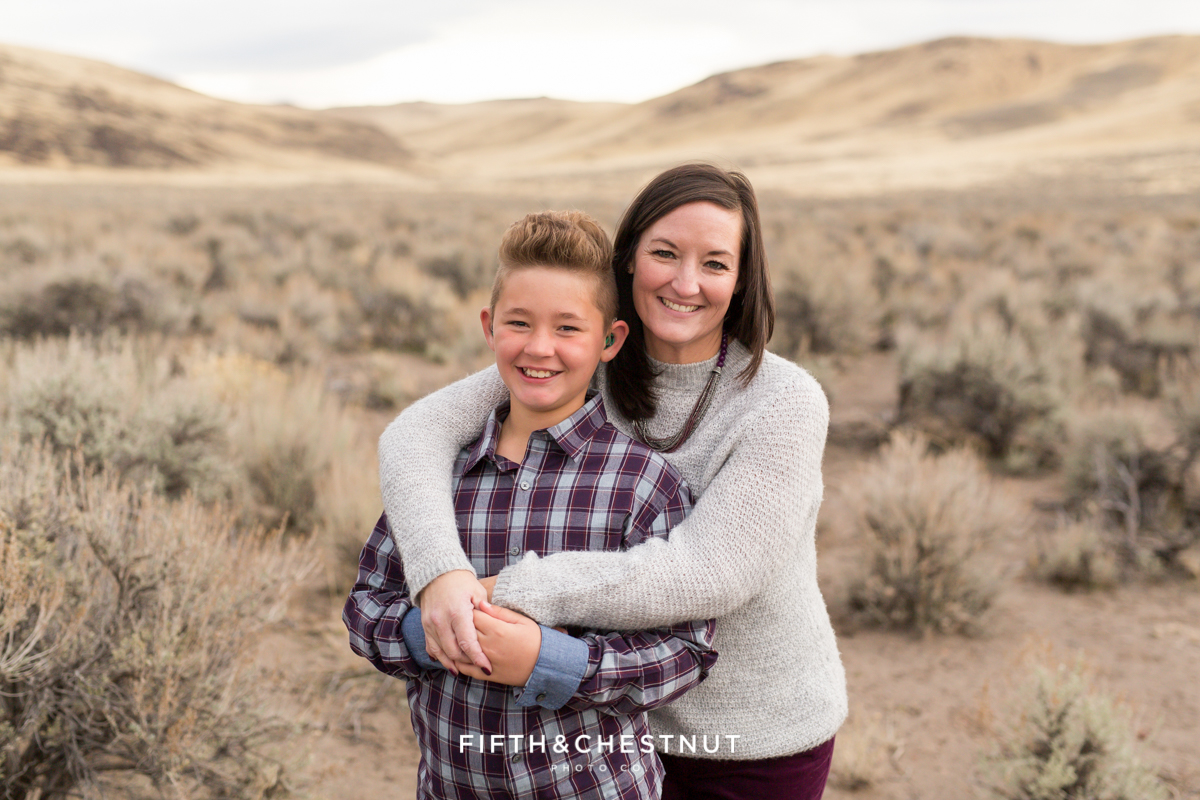 A mom hugging her son during family portraits by Reno Family Photographer
