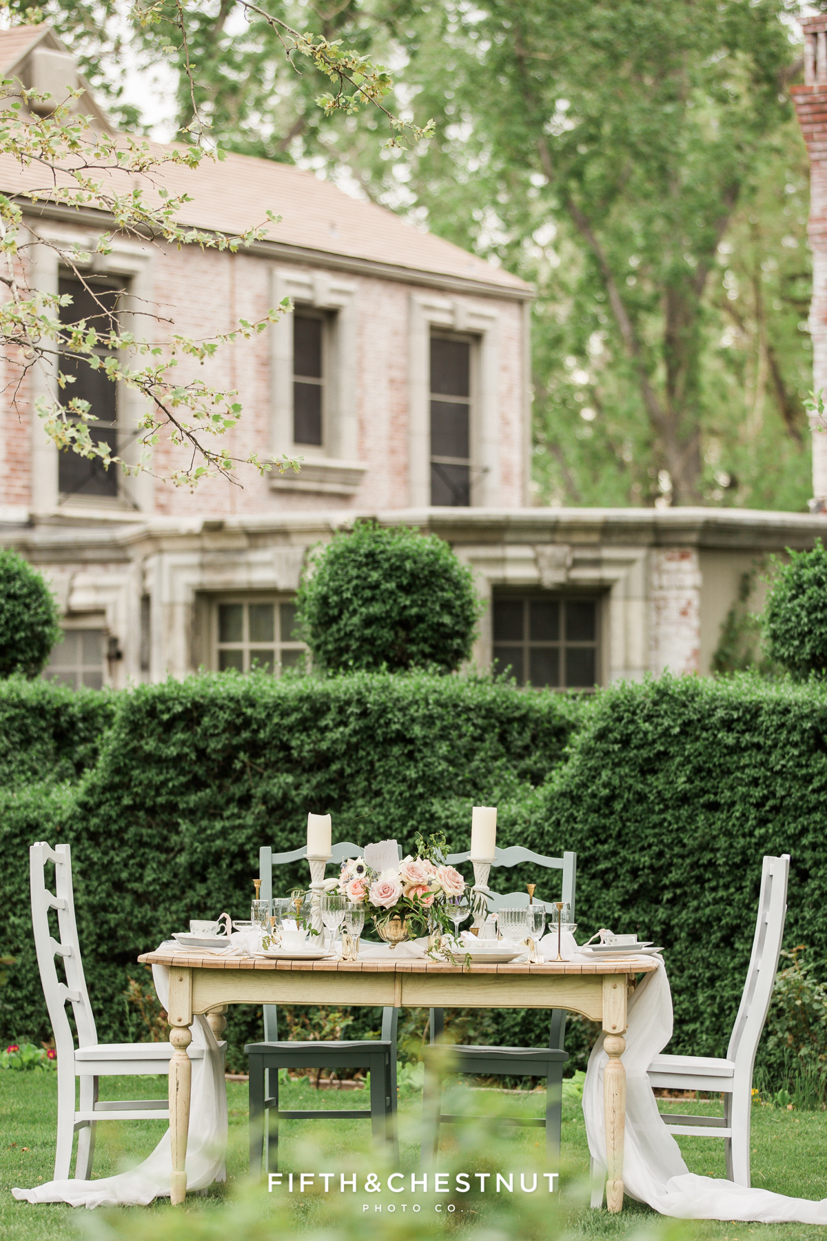A dusty blue country french wedding tablescape at a private estate