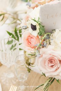 Up close detail of beautiful garden roses and anenome flowers in a Dusty Blue Private Estate Country French Wedding Styled Shoot centerpiece
