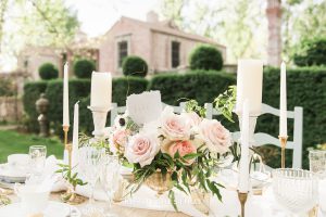 Country French wedding centerpiece in front of a brick and stone private estate in Reno, NV