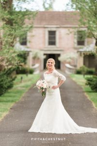 Happy bride laughing at a dusty blue country french wedding styled shoot at Reno private estate