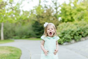 Toddler makes a funny and silly face at a Reno maternity portrait session by Reno Maternity photographer