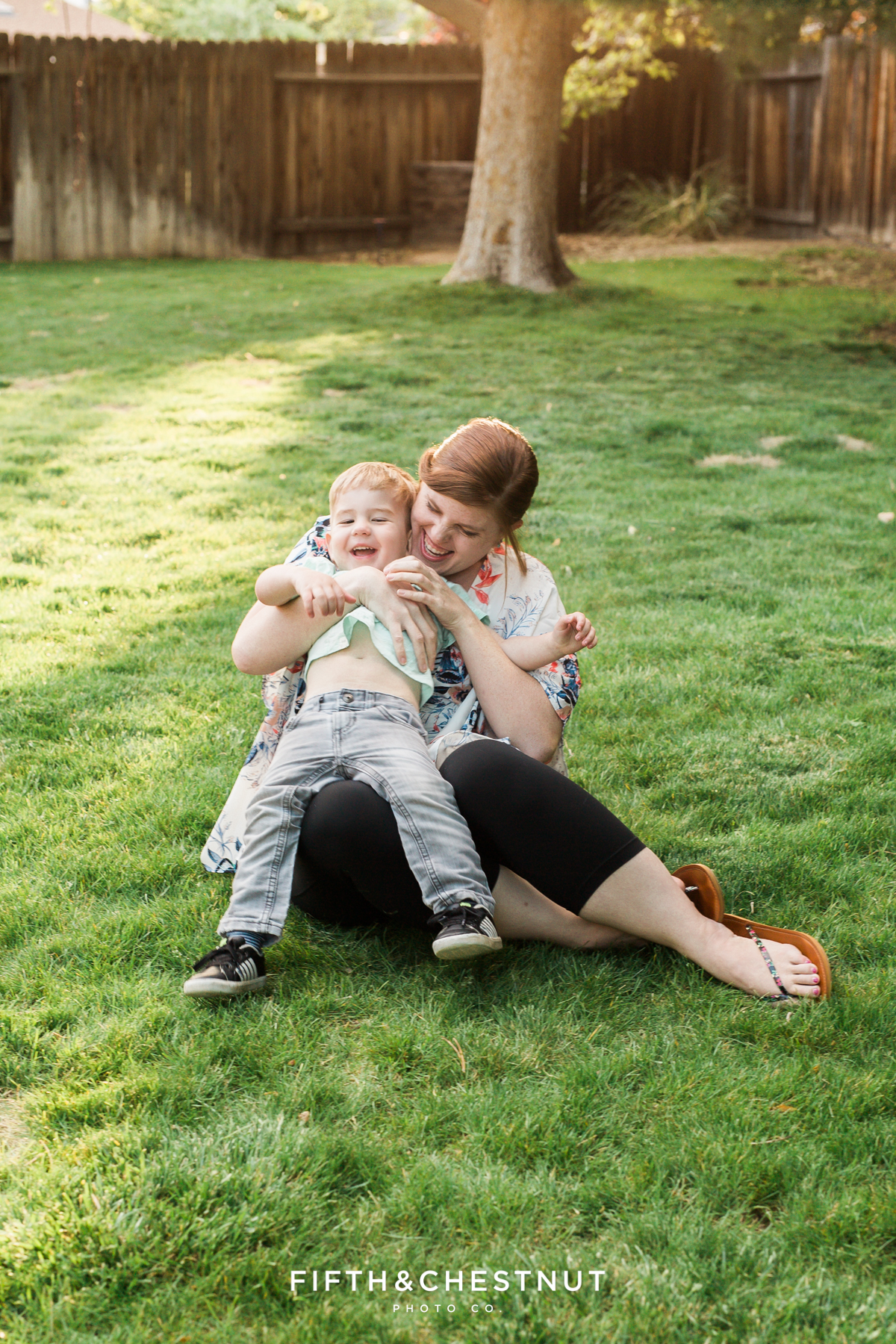 Reno Family Photographer mom tickling her toddler son on a spring day