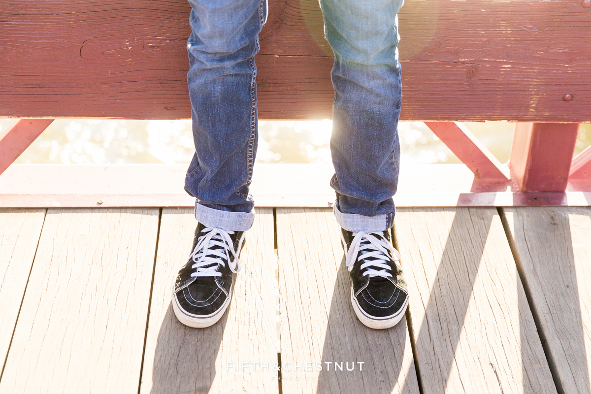 Fun photograph of a Reno high school senior's shoes on a bridge in downtown reno