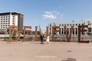 Bride and Groom in front of the Believe installation in downtown Reno before their Downtown Reno Elopement