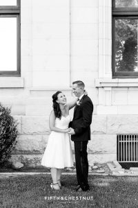 Black and white image of bride and groom laughing by Reno Wedding Photographer