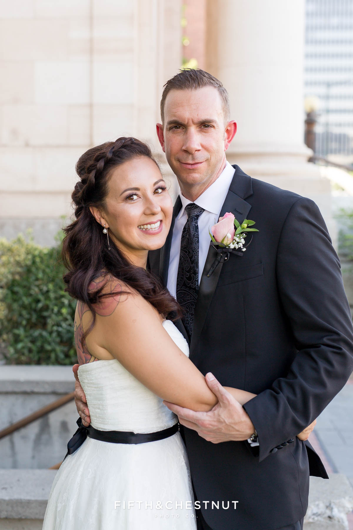 Bride and groom smile for their wedding portrait in Reno