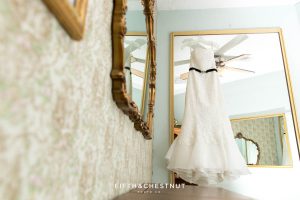 Wedding gown hanging from a closet in the Antique Angel Wedding Chapel in Reno before a Downtown Reno Elopement