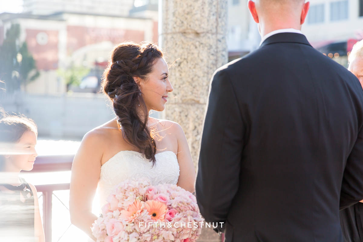 Bride looks at wedding officiant during her Downtown Reno Elopement