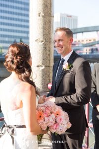 Groom smiles during Downtown Reno Elopement ceremony on the river