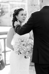 Groom wipes tears from Bride's eyes as she cries during her Downtown Reno Elopement ceremony on the river