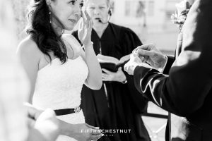 groom cries as groom is about to put on her wedding ring
