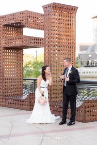 bride laughs while groom jokes at the believe installation in downtown reno