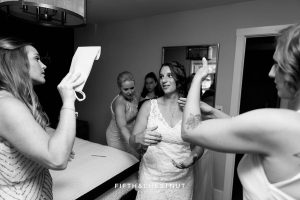 Bride shows emotion while her and her friends get ready for a North Lake Tahoe Wedding by Lake Tahoe Wedding Photographer