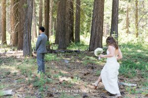 Bride walks up to her groom in the forest on the west shore for a first look before their north tahoe wedding