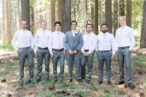 groom poses with his groomsmen in gray for his North Lake Tahoe Wedding