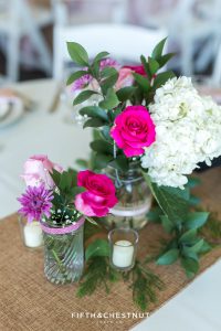 beautful roses, hydrangeas and other purple flowers set up on tables for a North Lake Tahoe Wedding