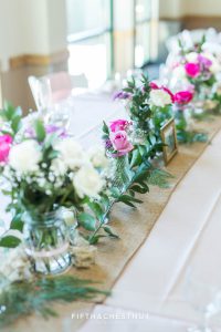 Flowers lined up on the head table for a North Lake Tahoe Wedding at North Tahoe Event Center