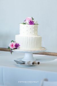 White 2-tier wedding cake with pink roses for a North Lake Tahoe Wedding by Flour Girl Wedding Cakes