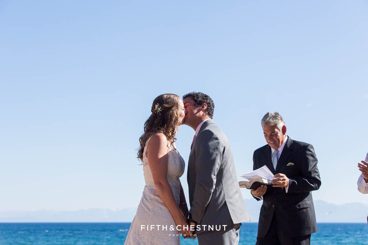 Bride and groom's first kiss and husband and wife at their North Lake Tahoe Wedding by Tahoe Photographer