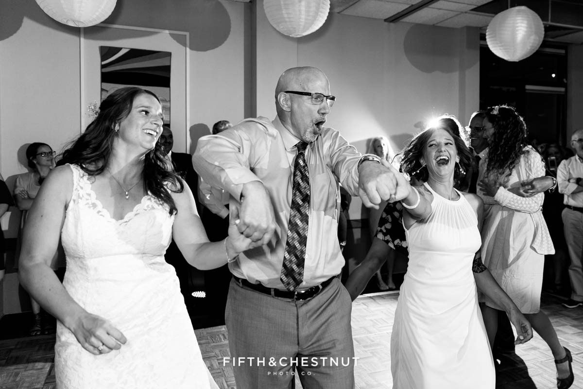 Father dances with his daughters at a North Tahoe Event Center Wedding