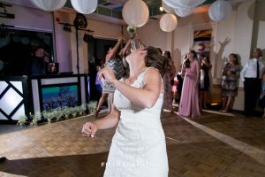 Bride throws her bouquet to the single ladies at her North Tahoe Event Center Wedding