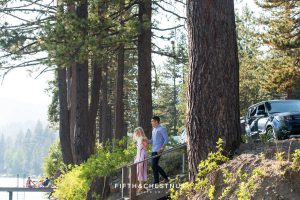 couple walks down steps towards private dock for a Donner Lake Proposal